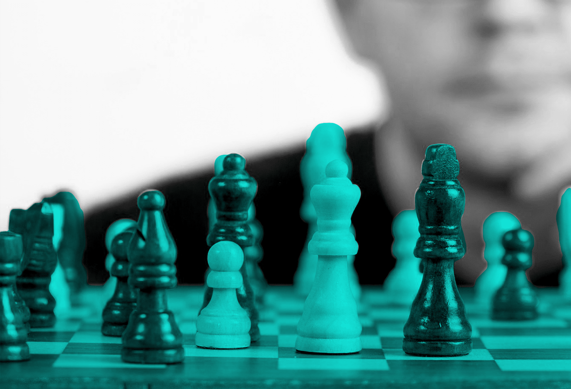 man gazing at a chess board